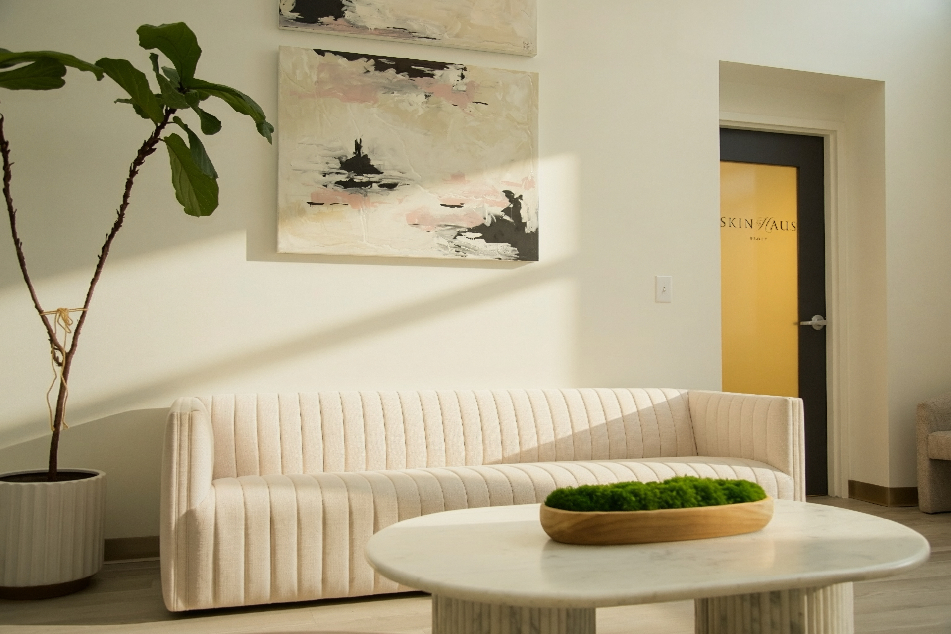 SKINHAUS lobby with curated seating and natural light